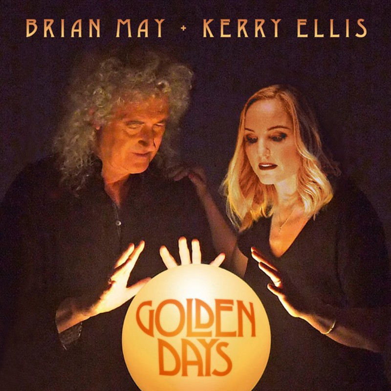 Album cover for Golden Days. Brian May and Kerry Ellis stand next to each other, their hands held over a large golden ball has the text Golden Days in the middle. Brian and Kerry's names are above their heads at the top of the cover.
