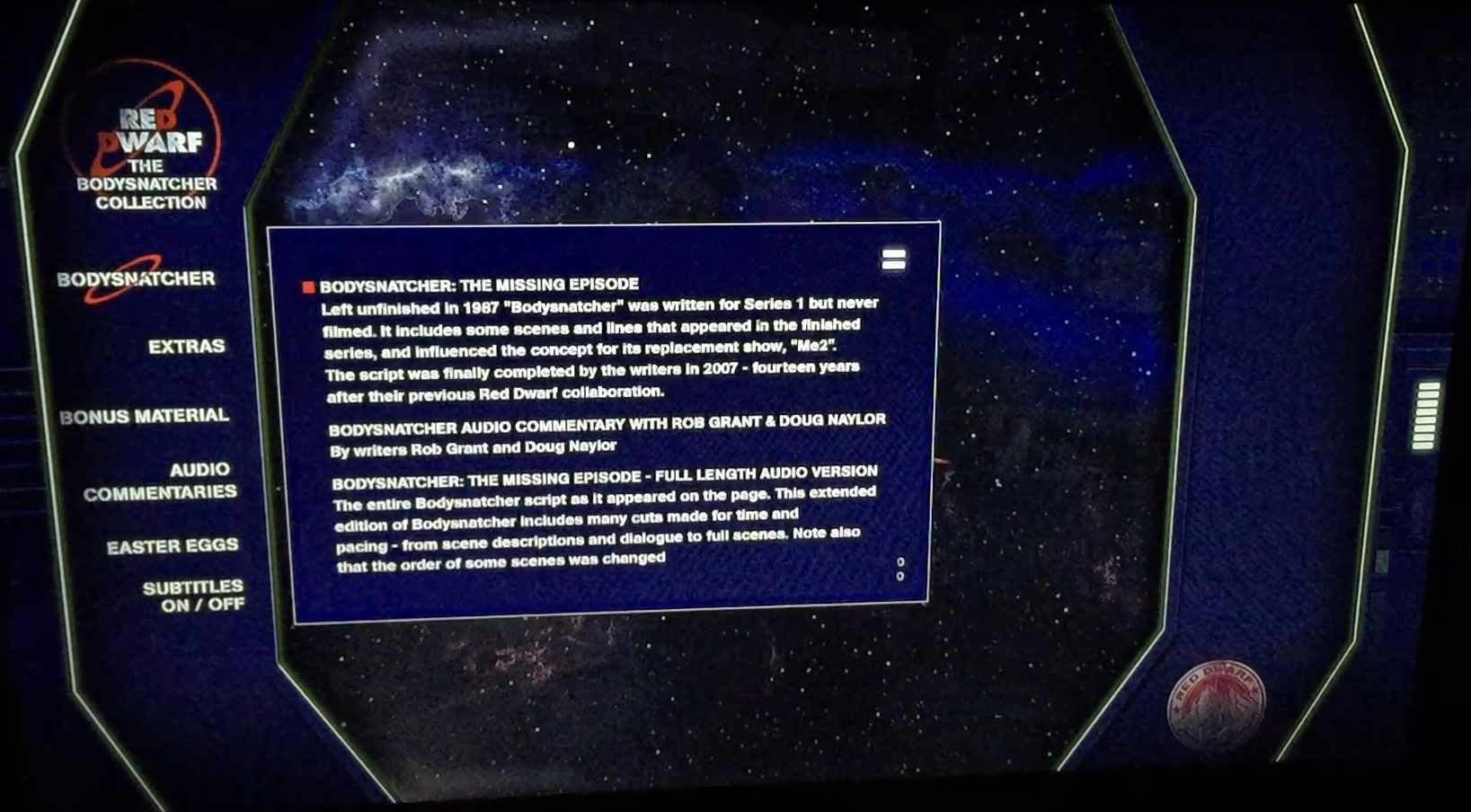 Menu for the Red Dwarf Bodysnatcher Blu-ray disc. Against a dark blue background on the left are options in white text for Bodysnatcher, Extras, Bonus Material, Audio Commentaries, Easter Eggs and Subtitles. The Bodysnatcher option is selected, revealing a large text box over a starry space background, with white text explaining the options for viewing the episode in its standard form with or without commentary, or a longer uncut version.