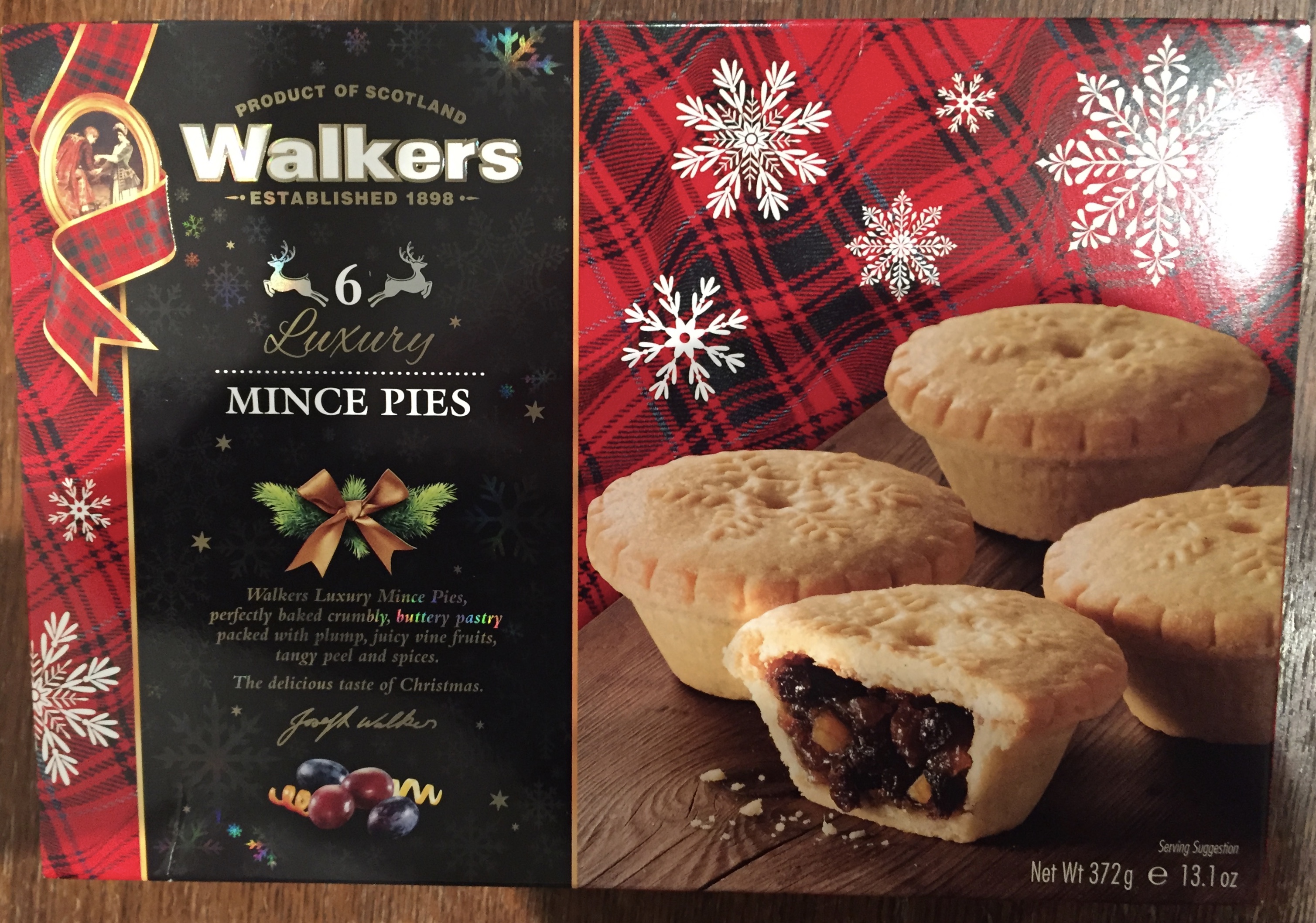 Pack of 6 Luxury Mince Pies from Walkers Shortbread. They are described on the box as having perfectly baked crumbly, buttery pastry packed with plump, juicy vine fruits, tangy peel and spices.