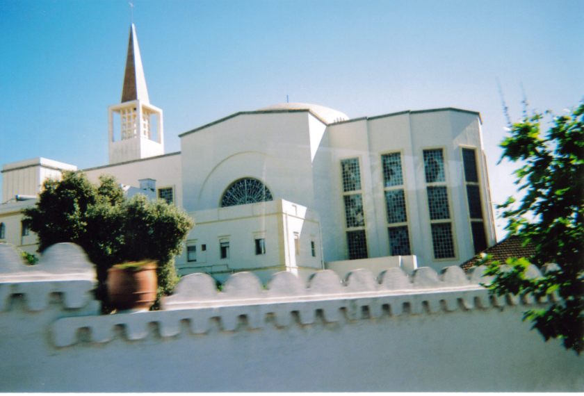 Large white building in Tangier, Morocco, including a tall pointed spire.