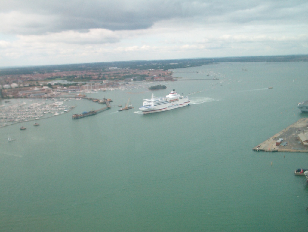 View from the Spinnaker Tower towards a large white Brittany Ferries ship approaching the harbour.