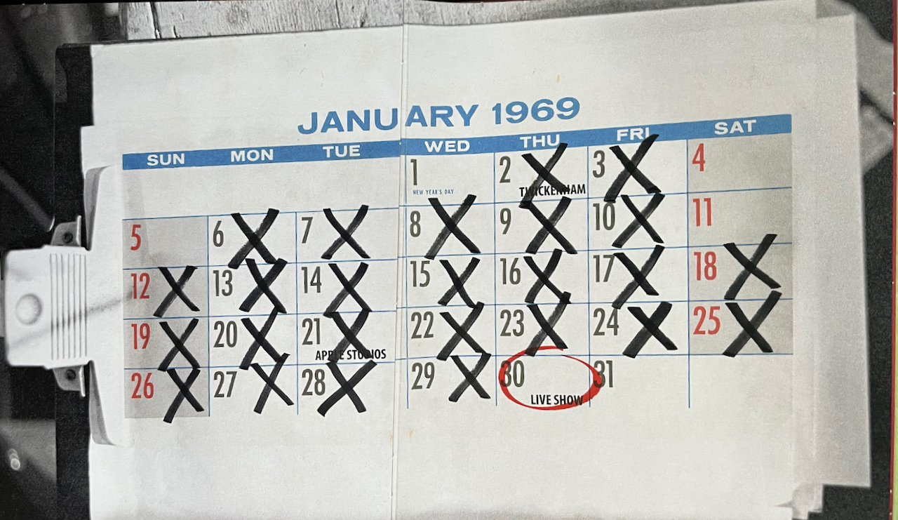 2 pages showing a large calendar for January 1969, on the inside of their Get Back Blu-ray set. Most days are crossed out, and a circle surrounds January 30th, which is labelled as Live Show.
