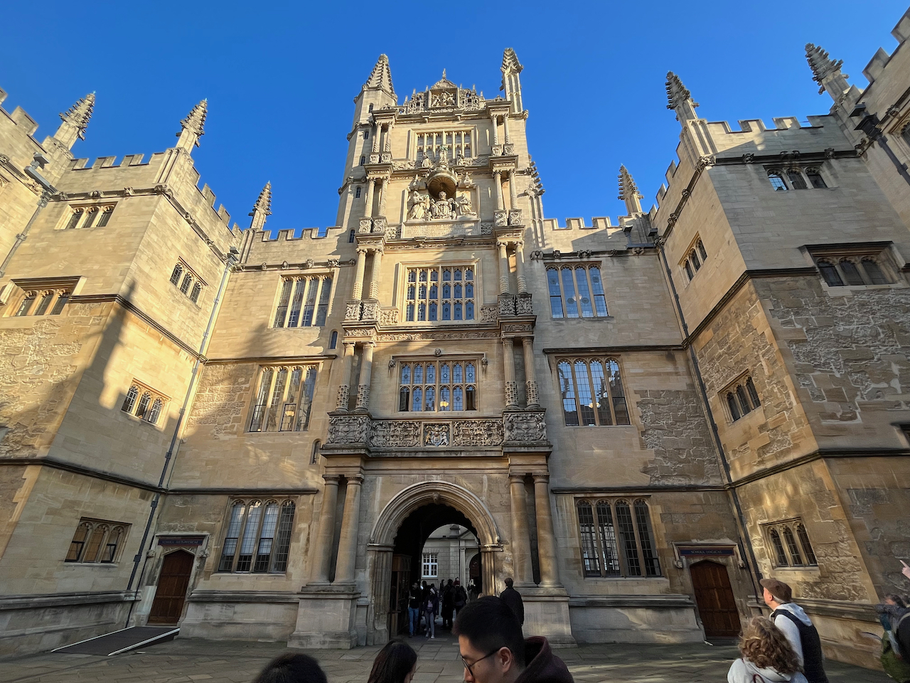 An ornately decorated 4 storey tower over the archway entrance to the Bodleian Library quadrangle.