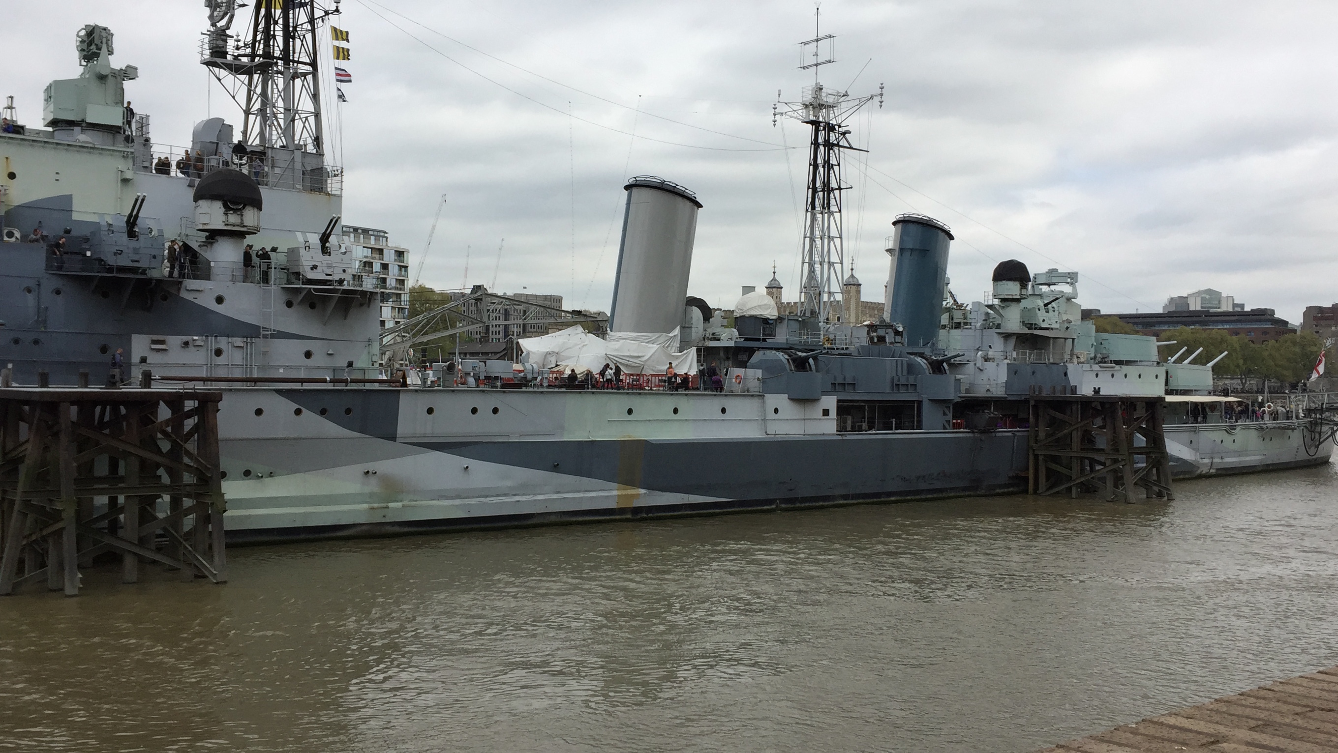 HMS Belfast, the large grey warship moored on the Thames.