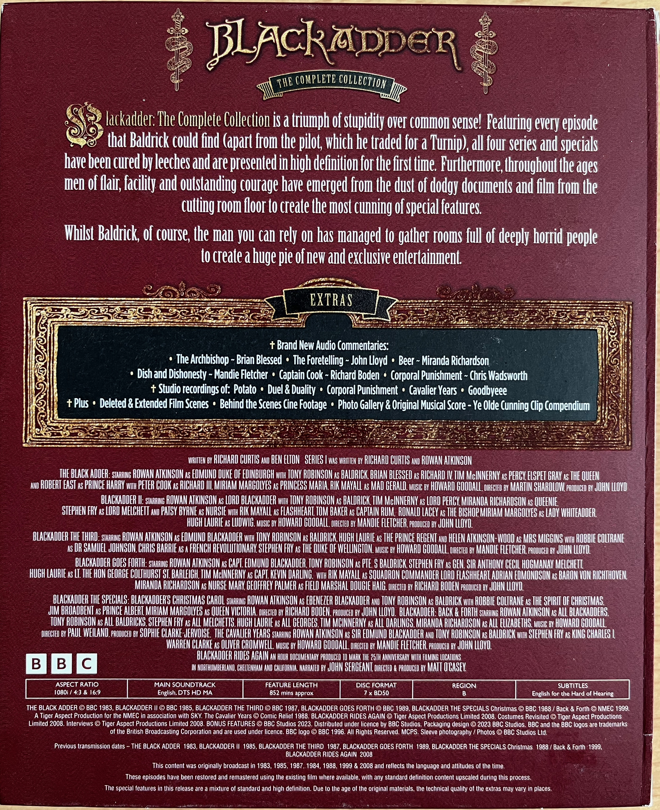Back cover of the Blackadder 40th anniversary Blu-ray set, with a brief description of the series, a list of the new extras, and credits for the series and specials.